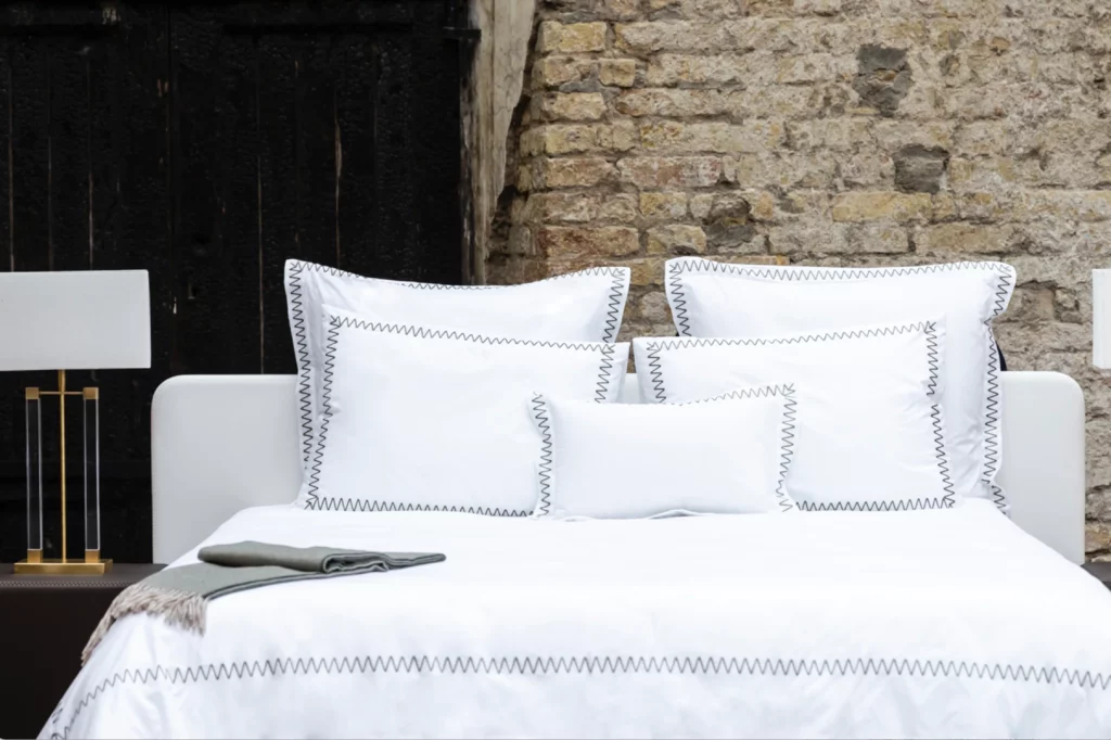 Luxury white yacht bedding on a superyacht bed.